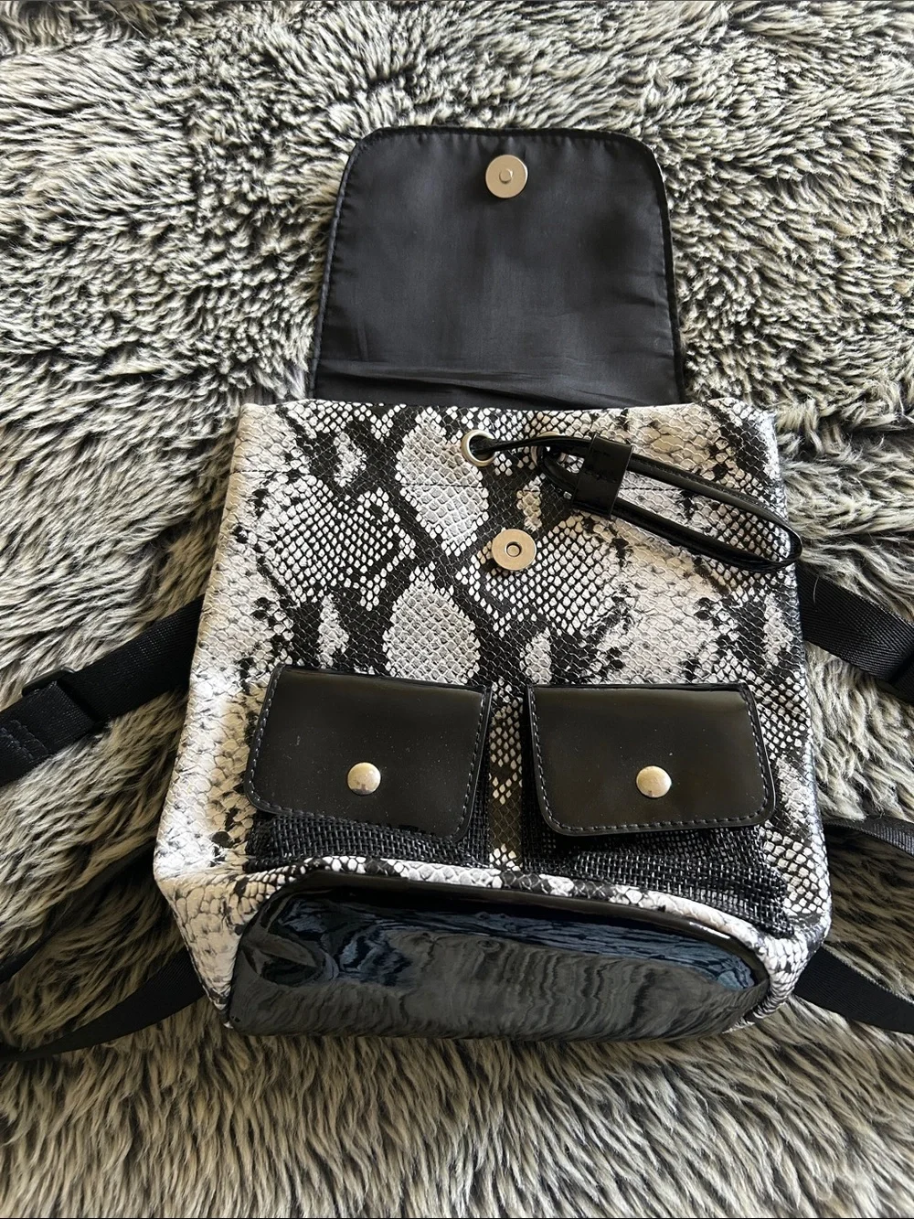 Small faux, snake skin and patent leather backpack